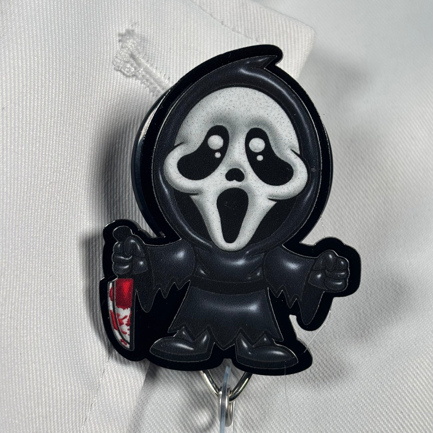 Puffy Black Scream Badge Reel
